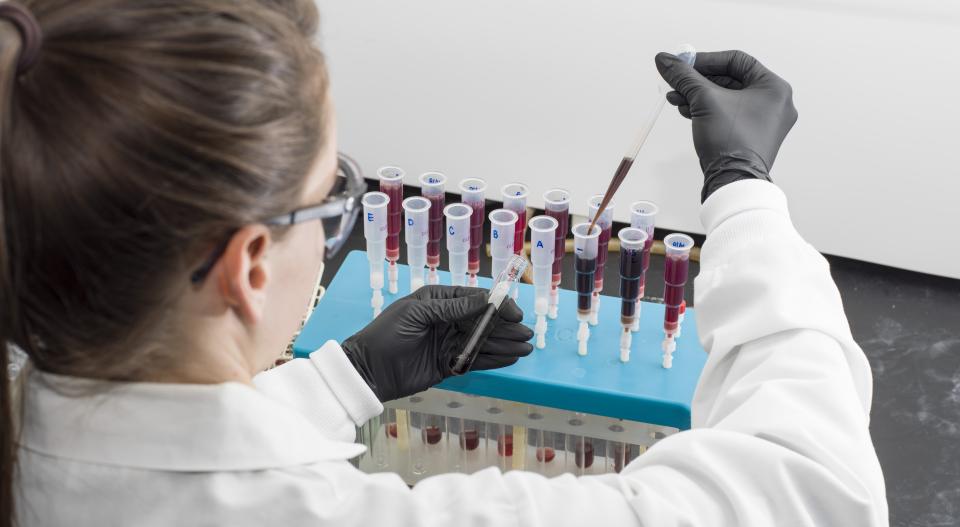 lady in the lab looking at samples