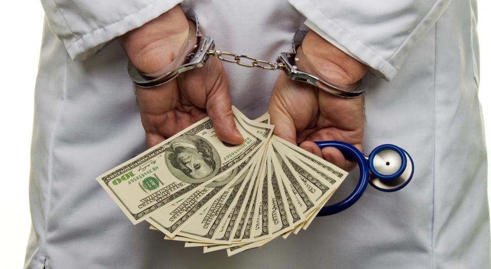 Handcuffed medical provider